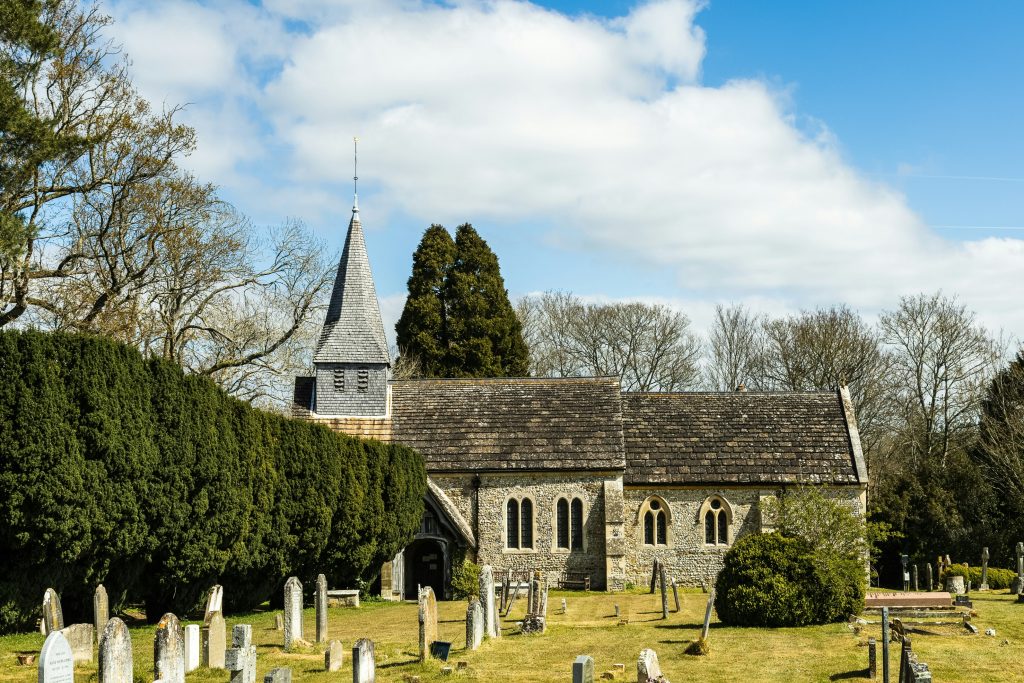 Blue Church Graveyard Building Architecture Plant Grass Tower Tomb Tombstone Conifer Steeple Spire